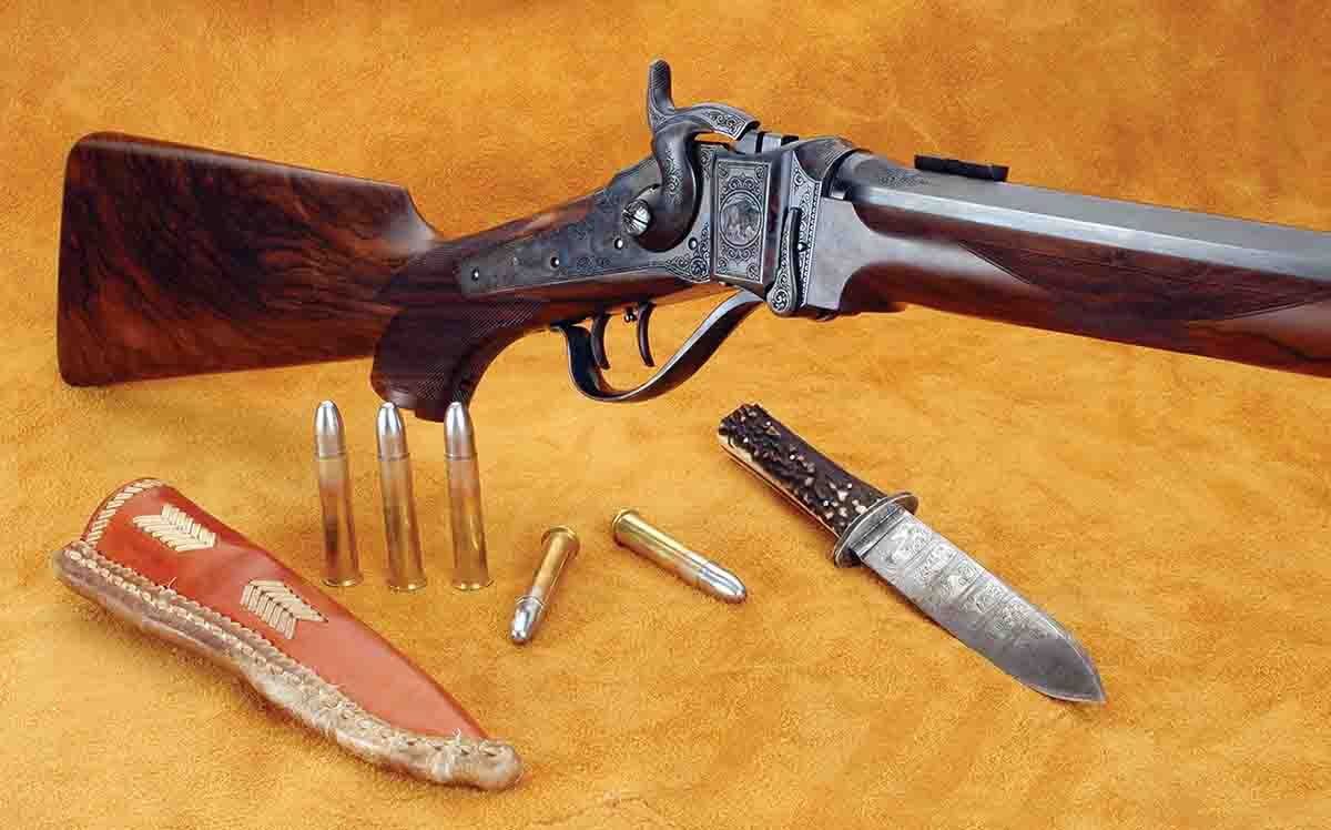 This Shiloh Sharps Model 1874 .45-70 features factory engraving and an English walnut stock. Steve Brooks made the knife.